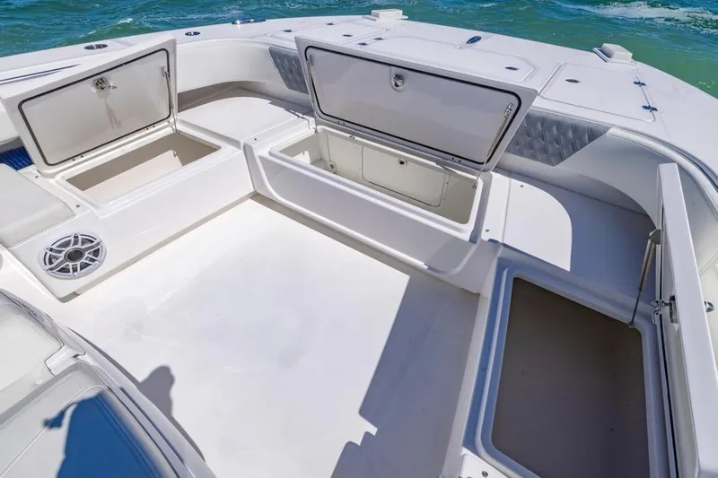 Yacht Photos Pics Spacious deck of 2023 Invincible 37 Catamaran with open storage compartments.