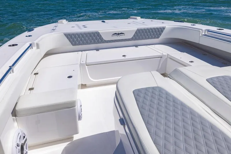  Yacht Photos Pics 2023 Invincible 37 Catamaran interior with cushioned seating and ocean backdrop.