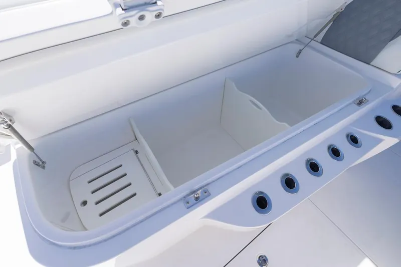  Yacht Photos Pics Open storage compartment on 2023 Invincible 37 Catamaran, featuring multiple rod holders.