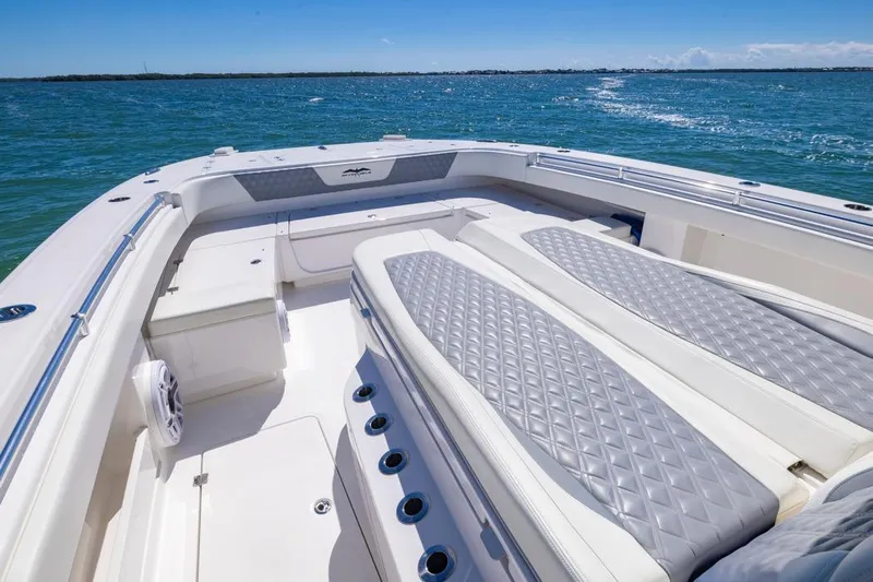  Yacht Photos Pics 2023 Invincible 37 Catamaran with luxurious seating on open water.