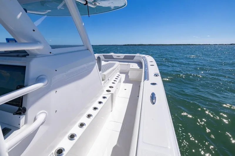  Yacht Photos Pics 2023 Invincible 37 Catamaran on open water, showcasing sleek design and spacious deck.