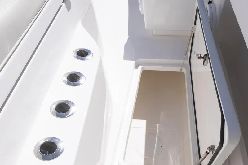  Yacht Photos Pics 2023 Invincible 37 Catamaran storage compartment with open hatch and rod holders.