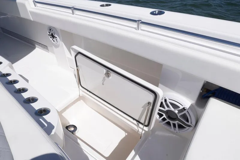 Yacht Photos Pics 2023 Invincible 37 Catamaran interior with storage compartment and speaker detail.