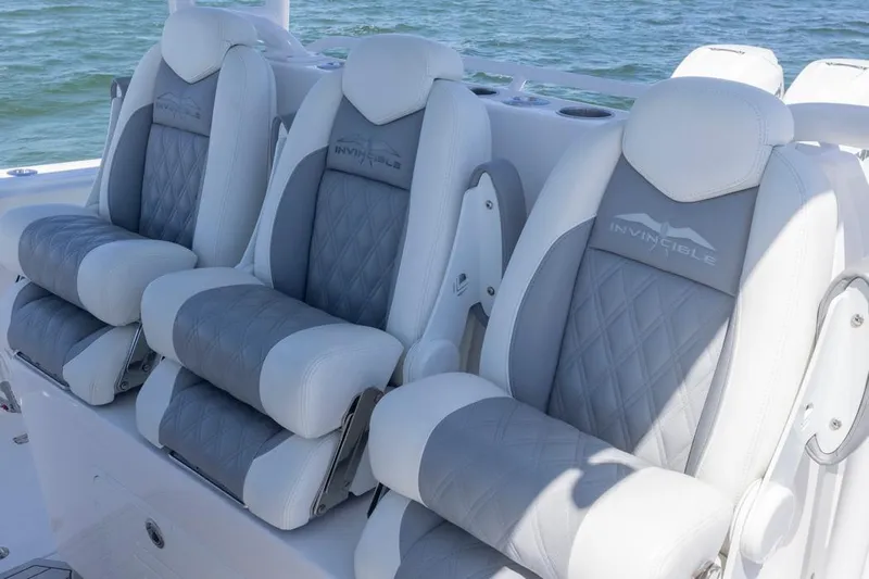  Yacht Photos Pics Luxurious seating on 2023 Invincible 37 Catamaran, featuring elegant gray and white upholstery.