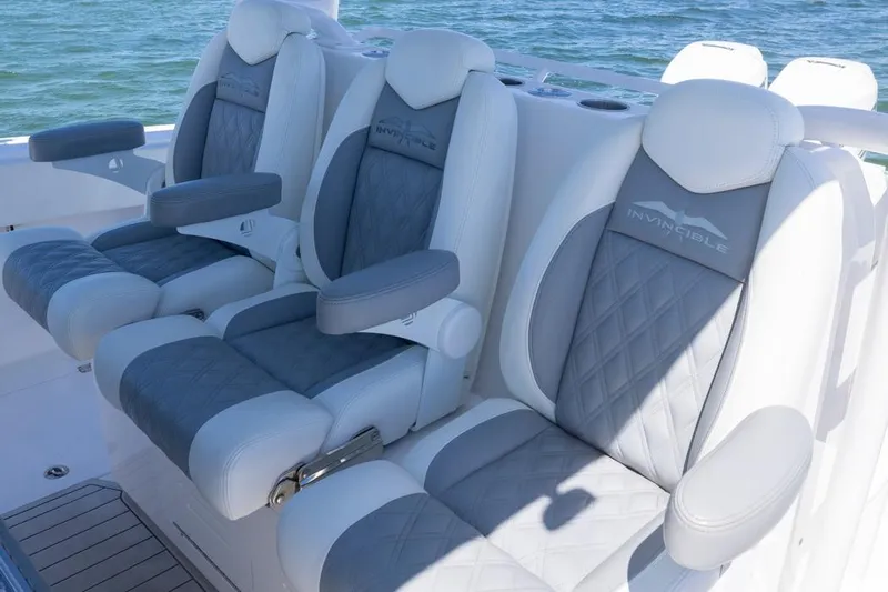  Yacht Photos Pics Luxury seating on 2023 Invincible 37 Catamaran, featuring elegant gray and white upholstery.