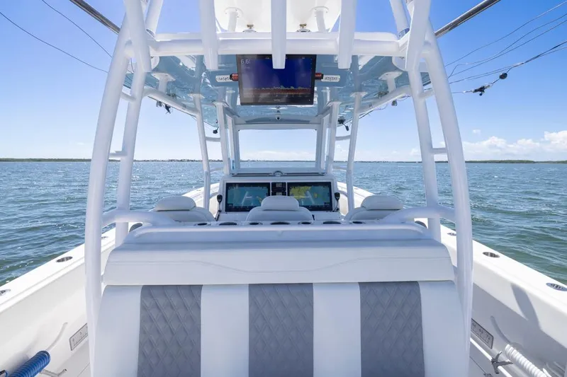  Yacht Photos Pics 2023 Invincible 37 Catamaran interior with advanced navigation system on open water.