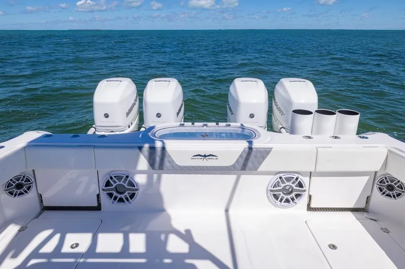  Yacht Photos Pics 2023 Invincible 37 Catamaran with four outboard engines on open sea.