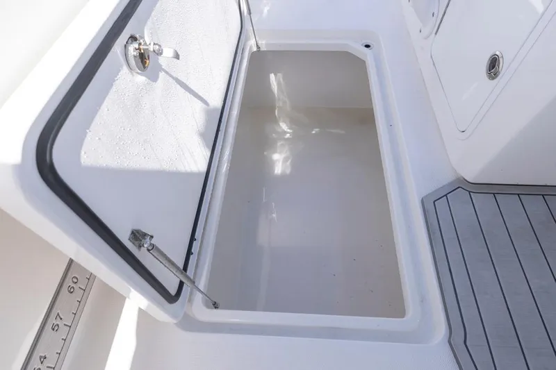  Yacht Photos Pics Open storage compartment on 2023 Invincible 37 Catamaran, featuring sleek design and durable materials.
