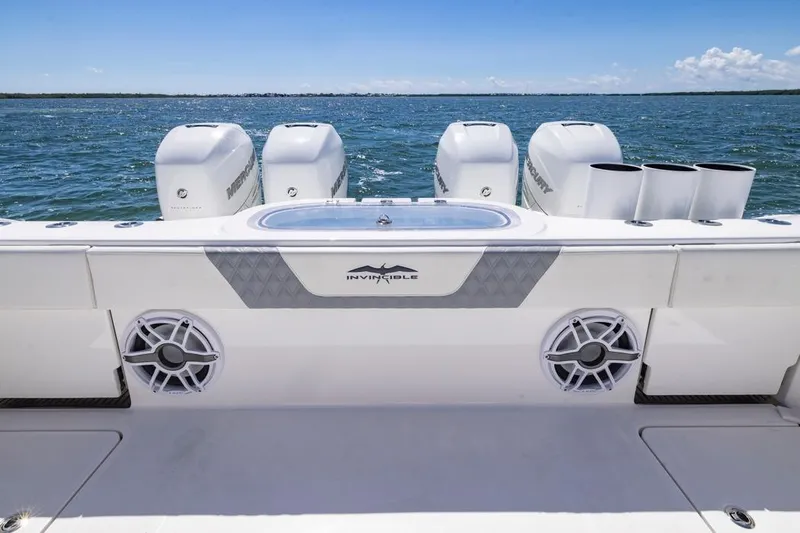  Yacht Photos Pics 2023 Invincible 37 Catamaran with powerful engines on open water.