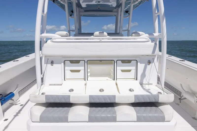  Yacht Photos Pics 2023 Invincible 37 Catamaran interior with storage compartments and seating, on open water.