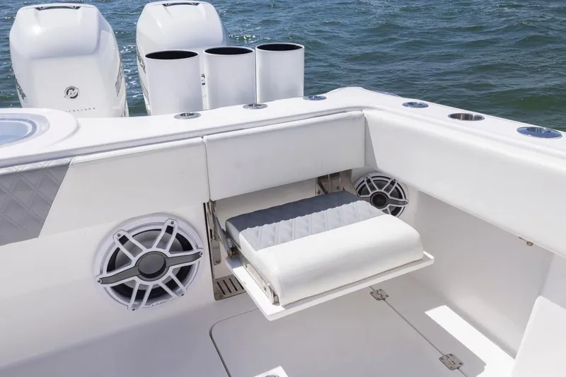  Yacht Photos Pics 2023 Invincible 37 Catamaran with seating, speakers, and ocean backdrop.