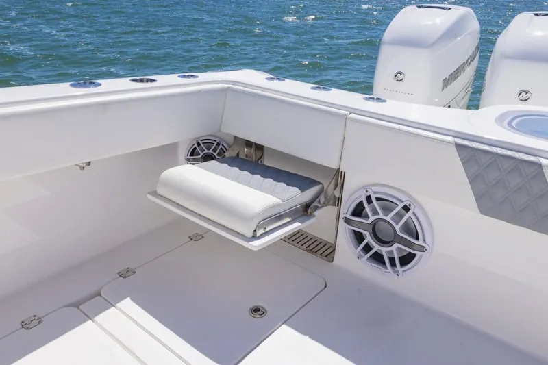  Yacht Photos Pics 2023 Invincible 37 Catamaran interior with seating and speaker, featuring dual Mercury engines.