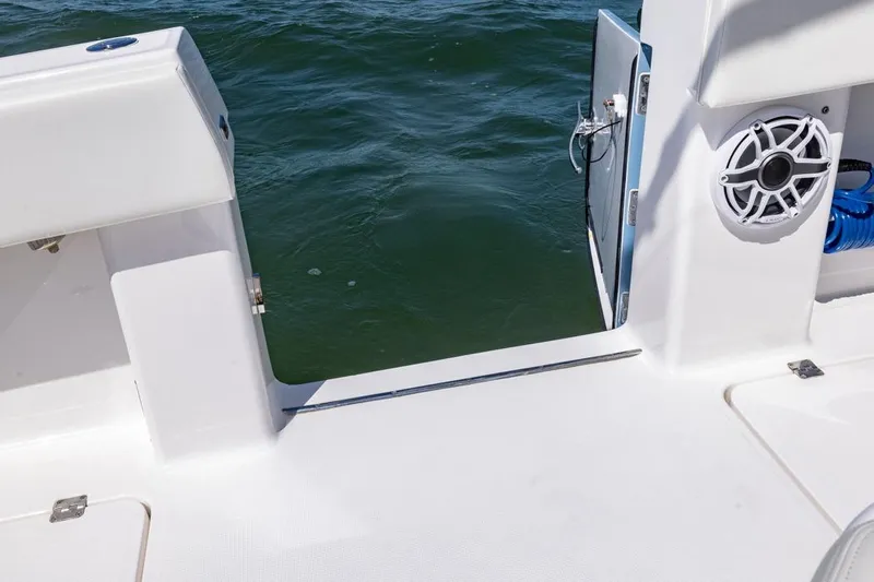  Yacht Photos Pics Invincible 37 Catamaran 2023, open deck view with water access and speaker.