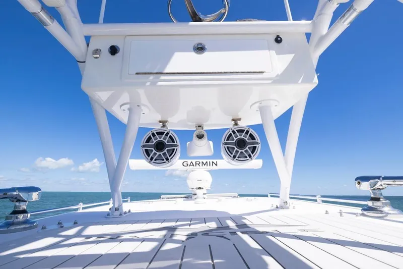  Yacht Photos Pics 2023 Invincible 37 Catamaran deck with Garmin speakers, under clear blue sky.
