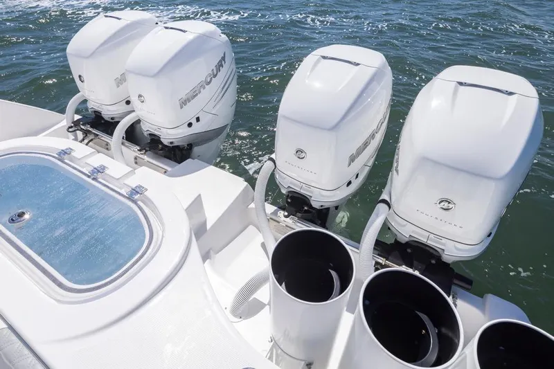  Yacht Photos Pics 2023 Invincible 37 Catamaran with four Mercury outboard engines on the water.