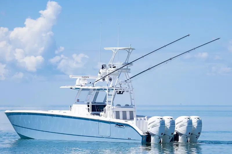  Yacht Photos Pics 2023 Invincible 37 Catamaran with four outboard engines on calm ocean waters.