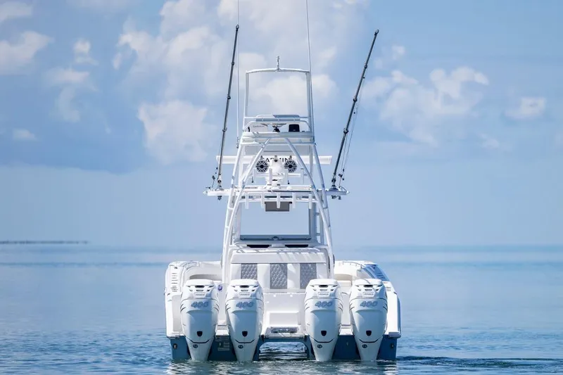  Yacht Photos Pics 2023 Invincible 37 Catamaran with four engines on calm ocean waters.