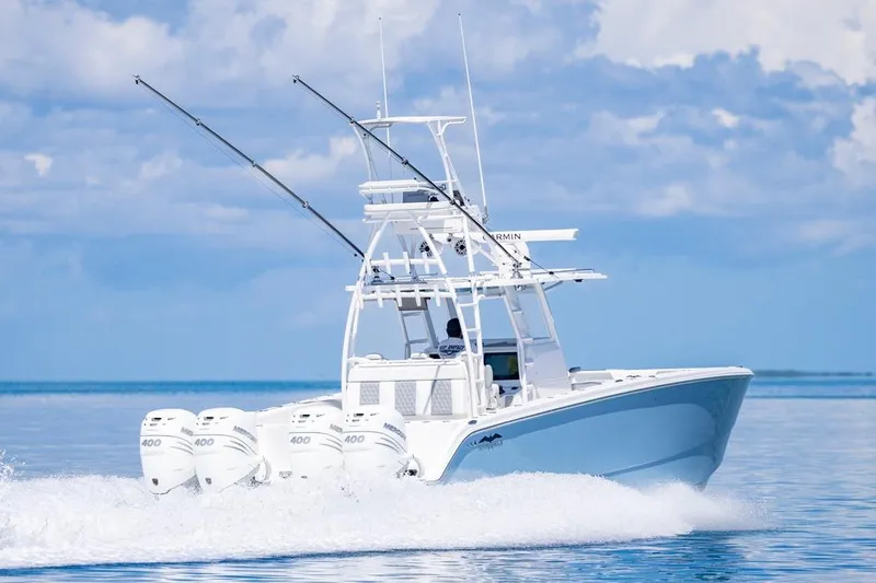  Yacht Photos Pics 2023 Invincible 37 Catamaran cruising on open water with four powerful engines.