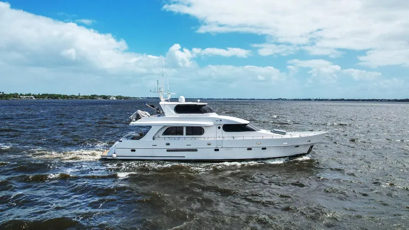 Cinnabar VI Yacht Photos Pics Grand Harbour 76 yacht cruising on open water, 2001 model.