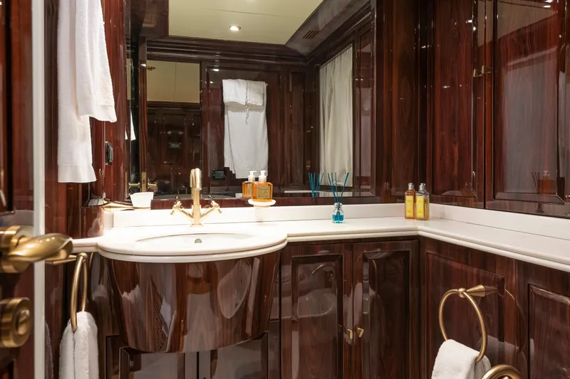 Claudia Berruto Yacht Photos Pics Luxurious bathroom on 2001 Baglietto M/Y 32 D yacht with elegant wood finish.