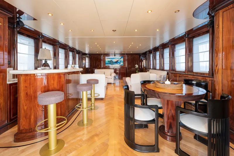 Claudia Berruto Yacht Photos Pics Luxurious interior of 2001 Baglietto M/Y 32 D yacht with elegant wood finishes and modern furnishings.