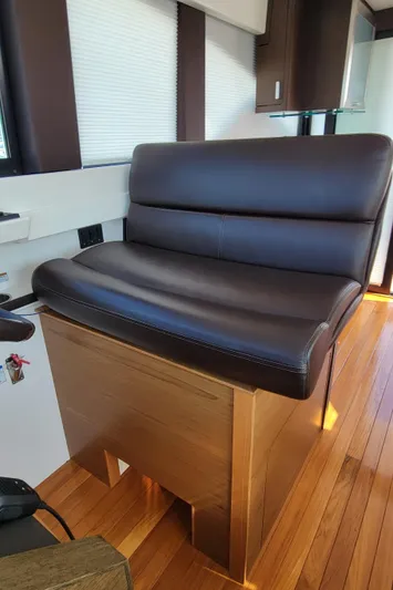 Lori L Yacht Photos Pics Luxurious leather seating in 2018 Tiara Yachts 39 interior with wooden flooring.