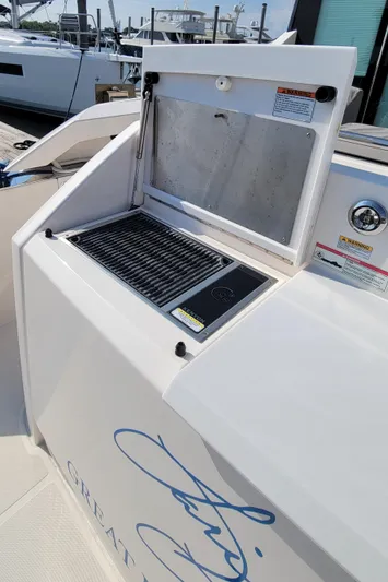 Lori L Yacht Photos Pics Outdoor grill on 2018 Tiara Yachts 39, docked at marina.