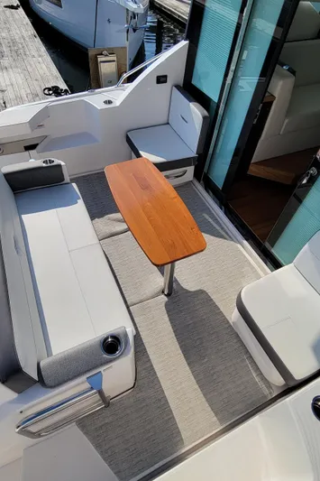 Lori L Yacht Photos Pics 2018 Tiara Yachts 39 interior with seating and wooden table.