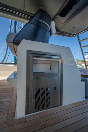  Yacht Photos Pics 2019 Bluegame BG42 yacht interior with built-in stainless steel appliance on wooden deck.