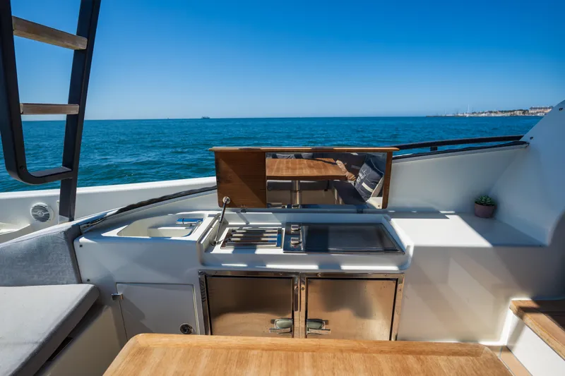  Yacht Photos Pics Outdoor kitchen on 2019 Bluegame BG42 yacht with ocean view.
