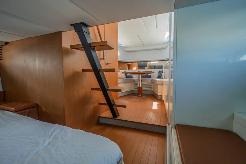  Yacht Photos Pics Interior of 2019 Bluegame BG42 yacht, featuring modern wooden design and sleek staircase.