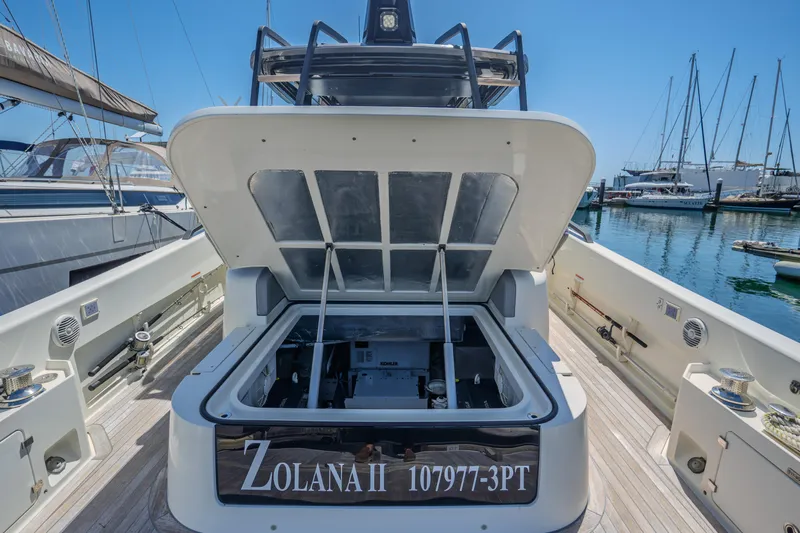  Yacht Photos Pics 2019 Bluegame BG42 yacht with open engine hatch at marina.