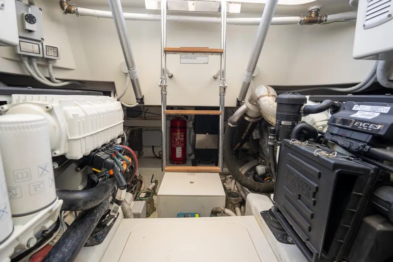  Yacht Photos Pics Engine room of 2019 Bluegame BG42 yacht, featuring mechanical components and safety equipment.
