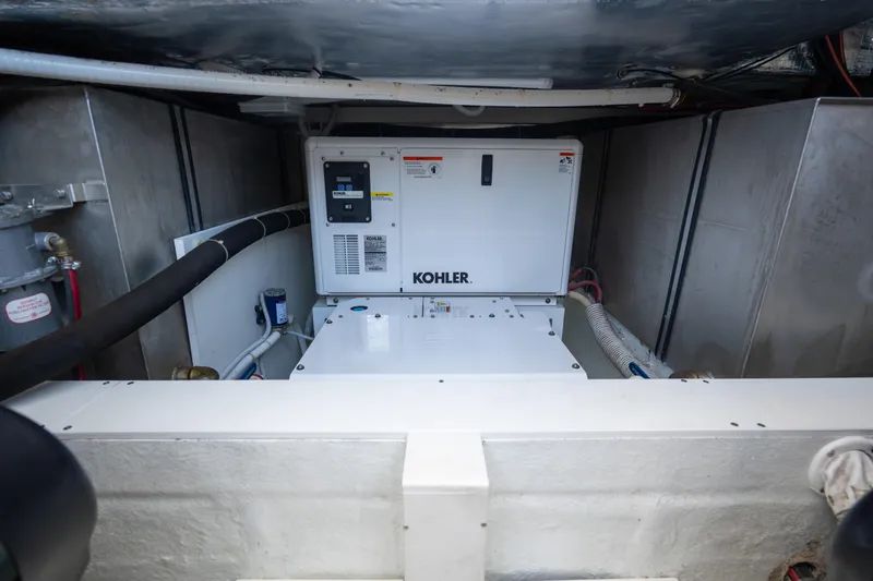  Yacht Photos Pics Engine room of 2019 Bluegame BG42 yacht featuring a Kohler generator.