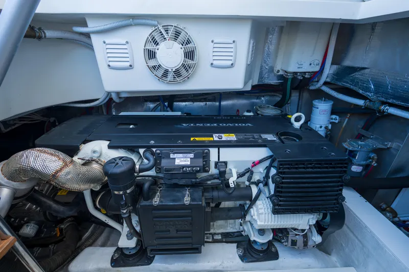  Yacht Photos Pics Engine room of 2019 Bluegame BG42 yacht, featuring a Volvo Penta engine and ventilation system.