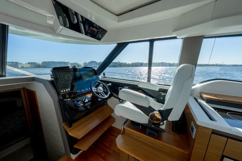 Next Level Yacht Photos Pics 2025 Tiara Yachts 43 LE helm with modern controls and panoramic water view.
