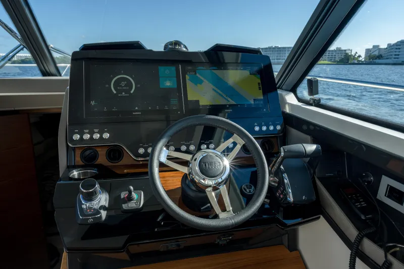 Next Level Yacht Photos Pics 2025 Tiara Yachts 43 LE helm with advanced navigation displays and controls.