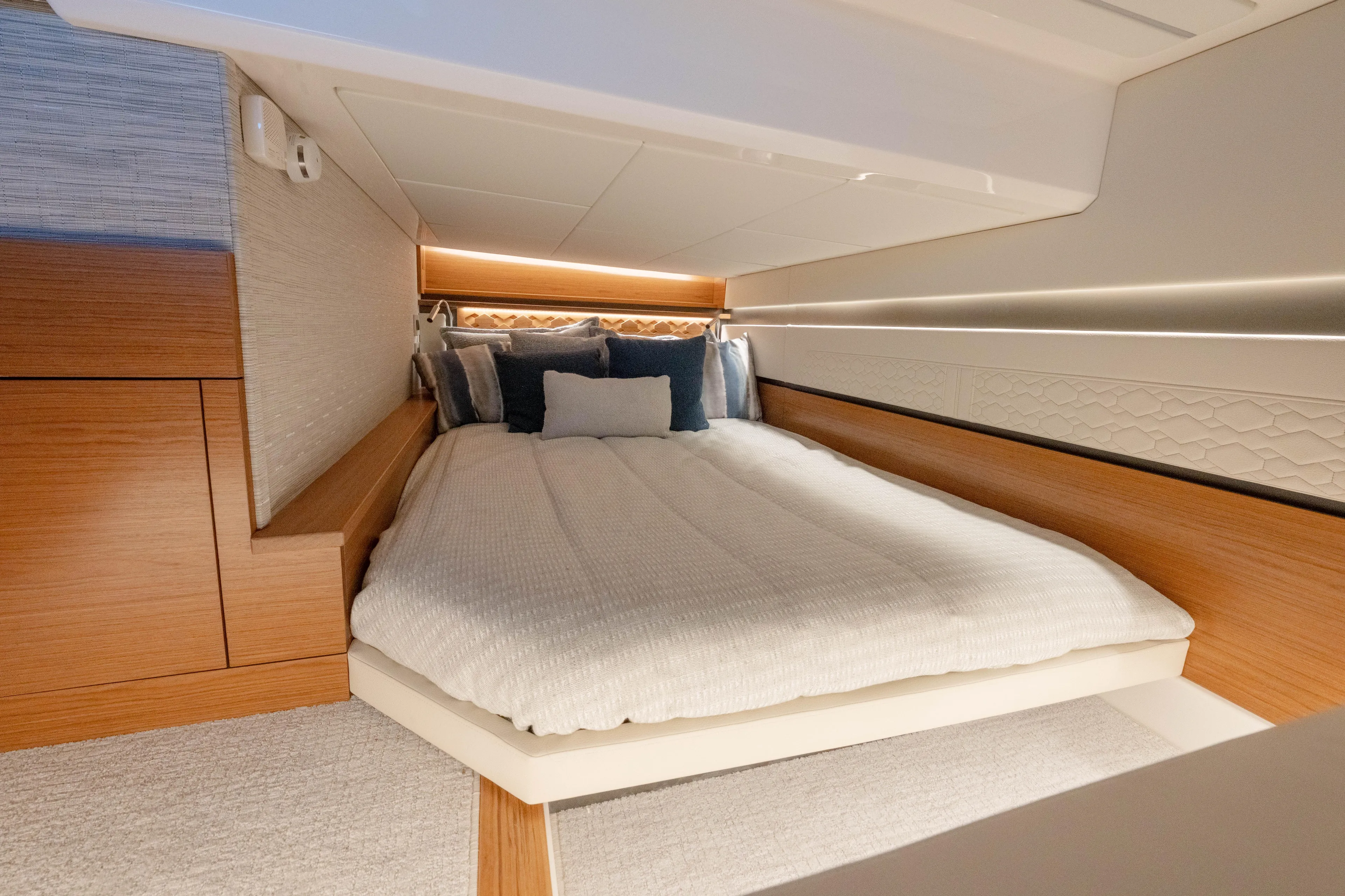 Next Level Yacht Photos Pics Luxurious cabin interior of 2025 Tiara Yachts 43 LE with cozy bedding.
