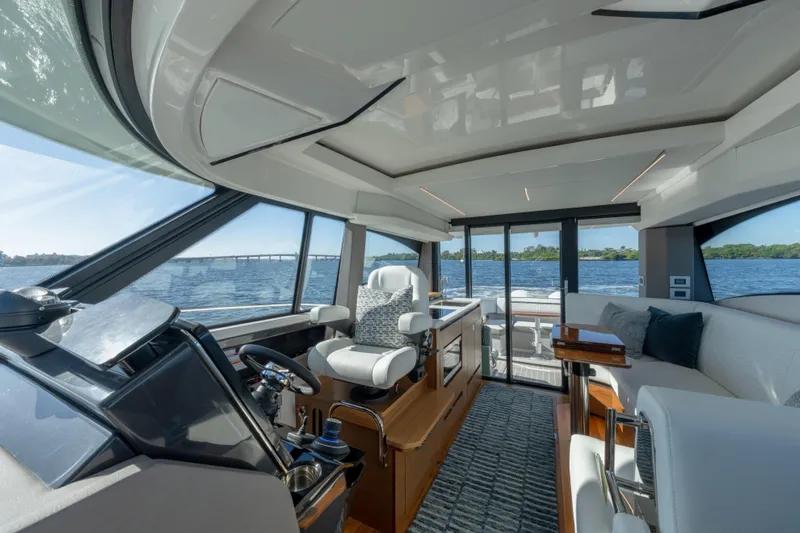 Next Level Yacht Photos Pics Luxurious interior of 2025 Tiara Yachts 43 LE, featuring modern helm and seating.