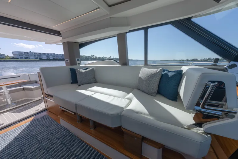 Next Level Yacht Photos Pics Luxurious interior of 2025 Tiara Yachts 43 LE with elegant seating and scenic water view.