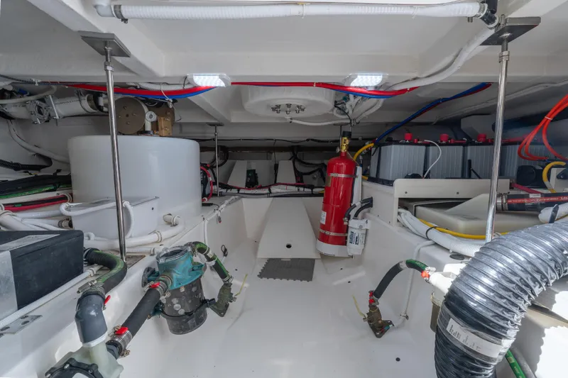 Next Level Yacht Photos Pics Engine room of 2025 Tiara Yachts 43 LE, showcasing equipment and wiring.