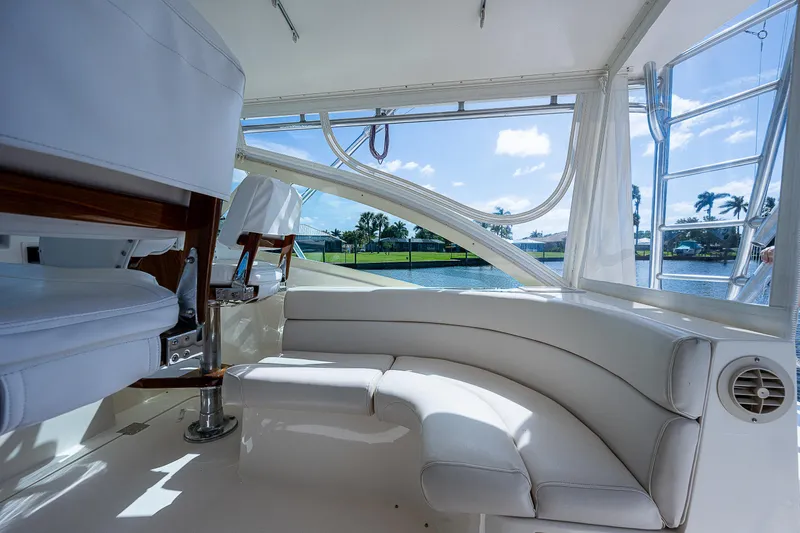 Atica Yacht Photos Pics Luxurious seating area on a 2005 Albemarle 410 yacht with waterfront view.