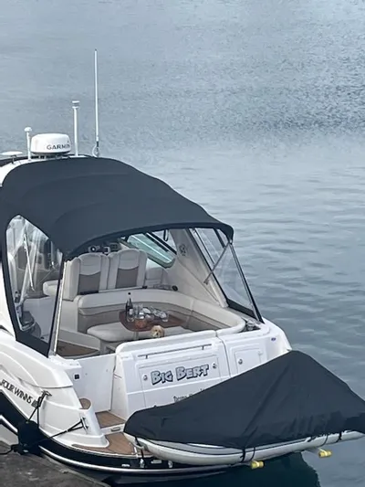  Yacht Photos Pics 2006 Four Winns 350 boat docked, featuring a covered seating area and sleek design.