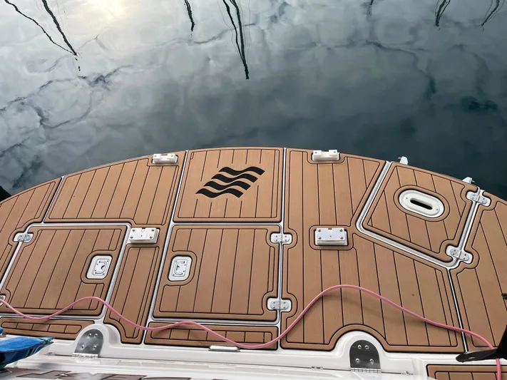  Yacht Photos Pics 2006 Four Winns 350 boat deck with wood finish and water reflection.