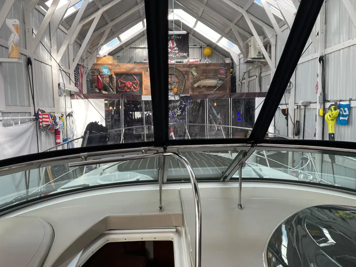  Yacht Photos Pics 2006 Four Winns 350 boat inside a spacious, well-lit storage facility.