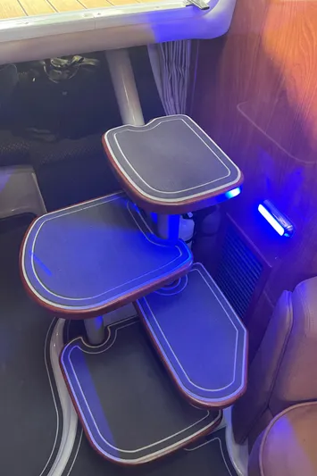  Yacht Photos Pics Interior stairs of a 2006 Four Winns 350 boat with blue LED lighting.