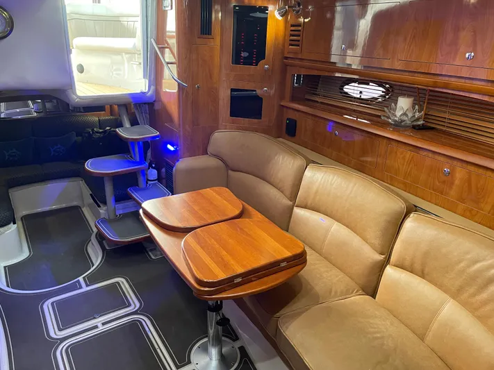  Yacht Photos Pics Luxurious 2006 Four Winns 350 yacht interior with elegant wood finishes and comfortable seating.