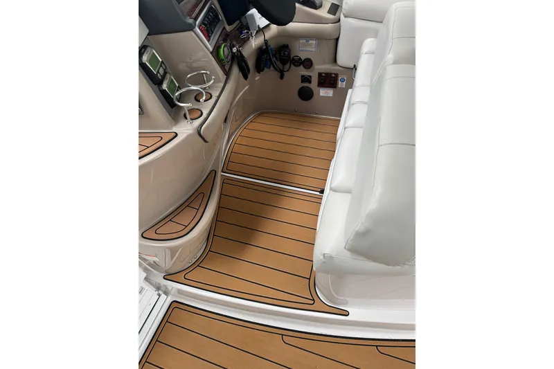  Yacht Photos Pics Interior of 2006 Four Winns H350 boat with wood-style flooring and white seating.