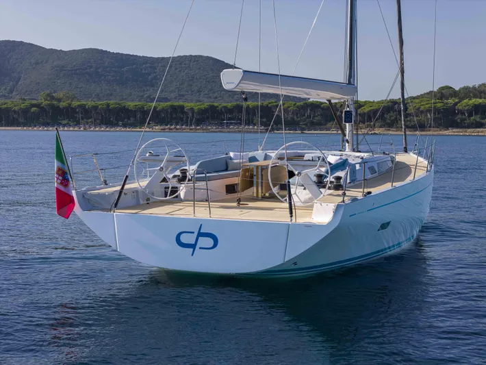  Yacht Photos Pics 2026 Grand Soleil 52 Performance yacht on calm water, featuring sleek design and dual steering wheels.