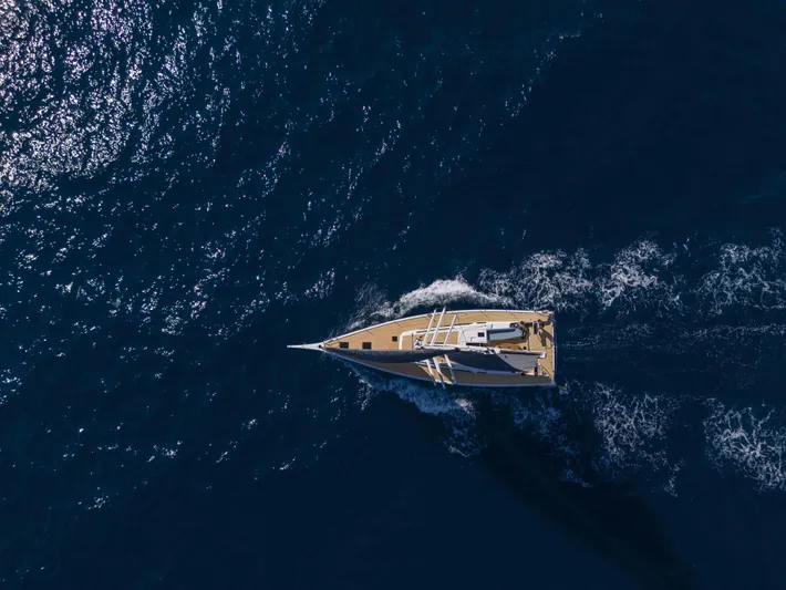  Yacht Photos Pics Aerial view of 2026 Grand Soleil 52 Performance yacht sailing on open sea.